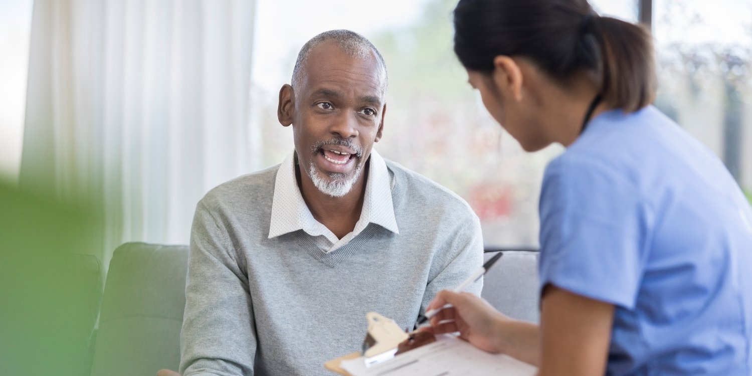 Patient in conversation with caregiver.