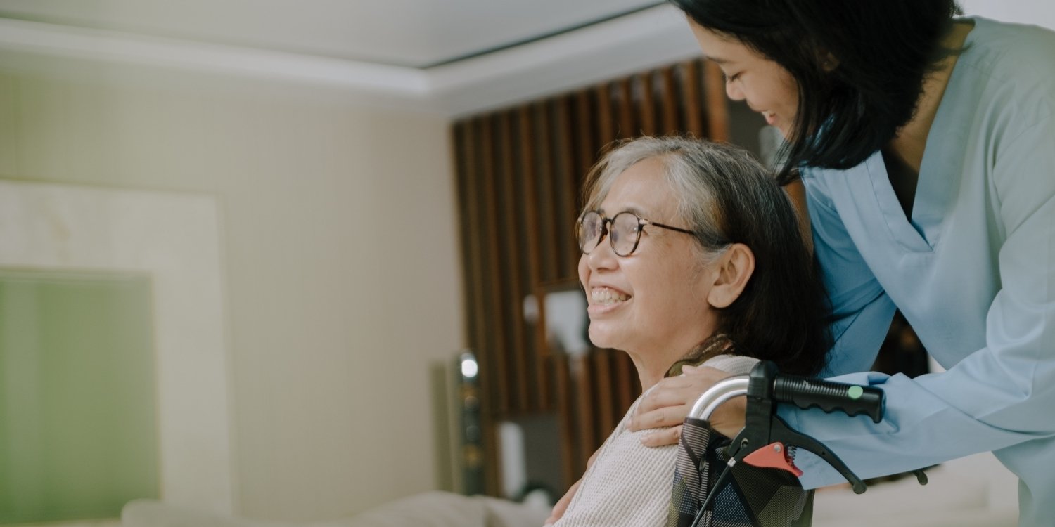 Smiling patient and caregiver.
