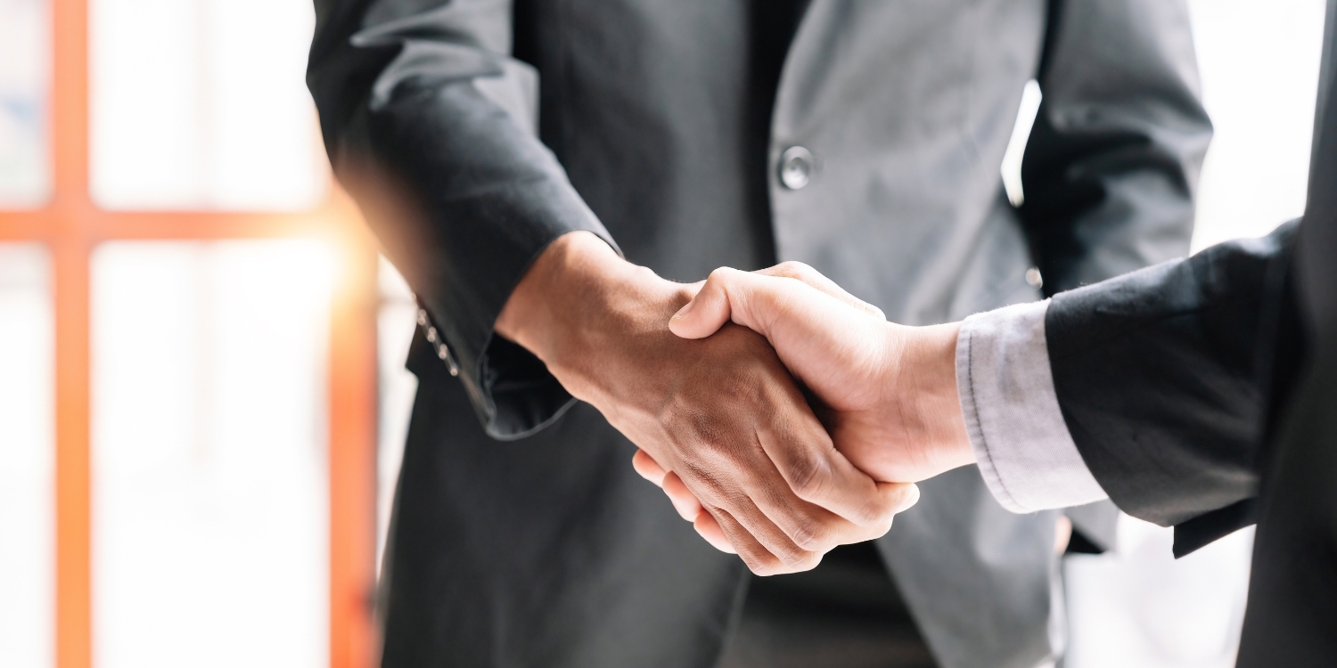 Businesspeople shaking hands.