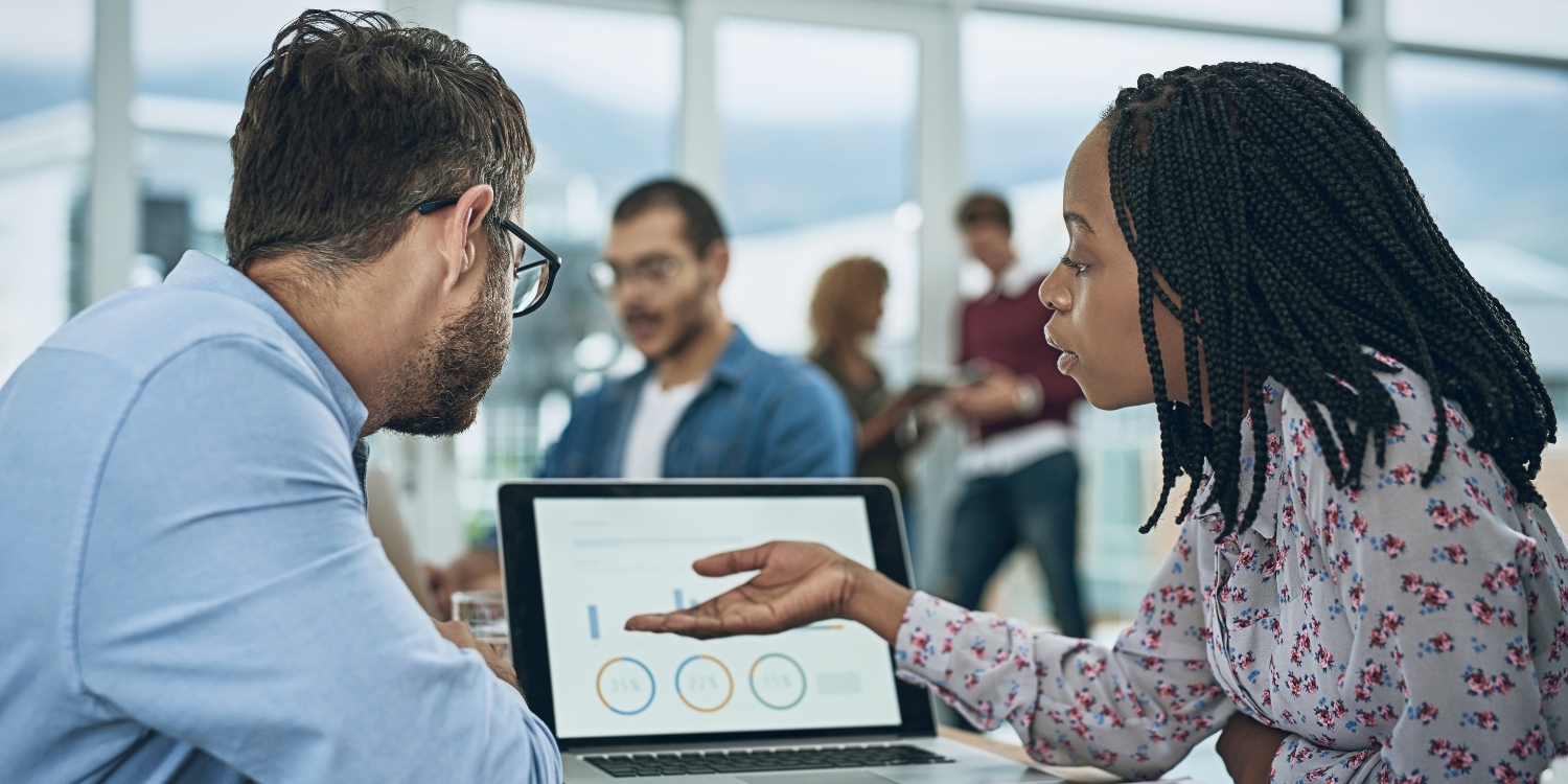 Two professionals viewing data