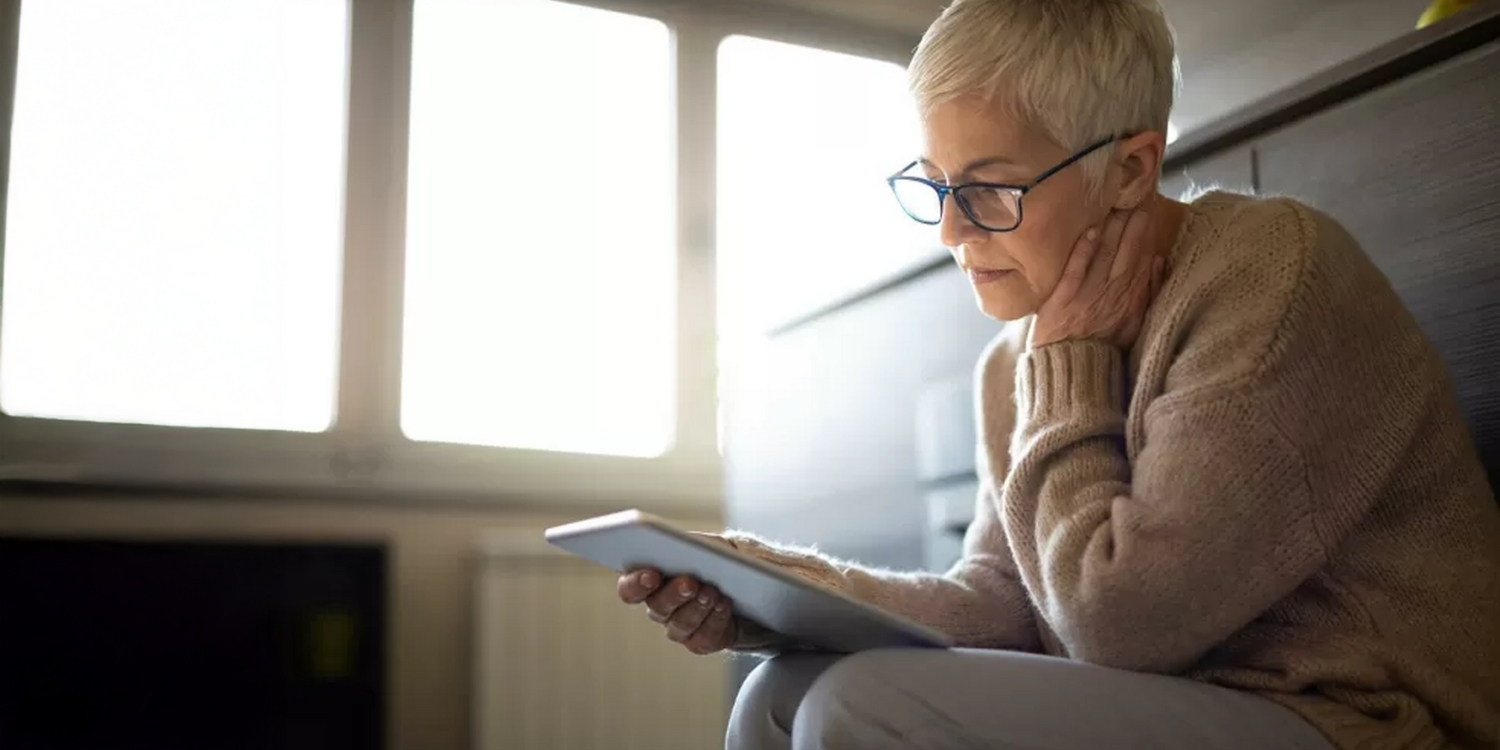 Woman viewing tablet.