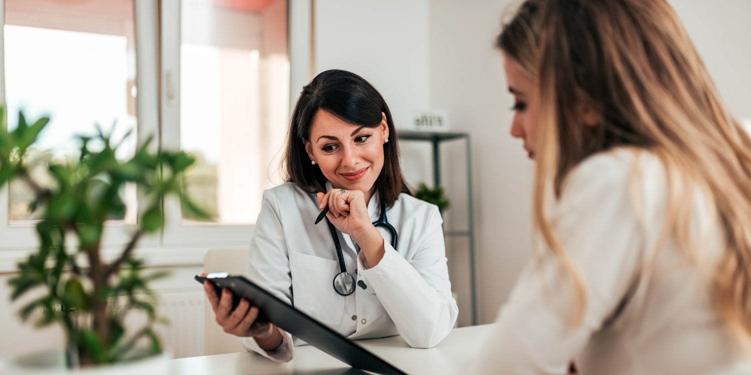 Clinician reviewing a chart with patient.