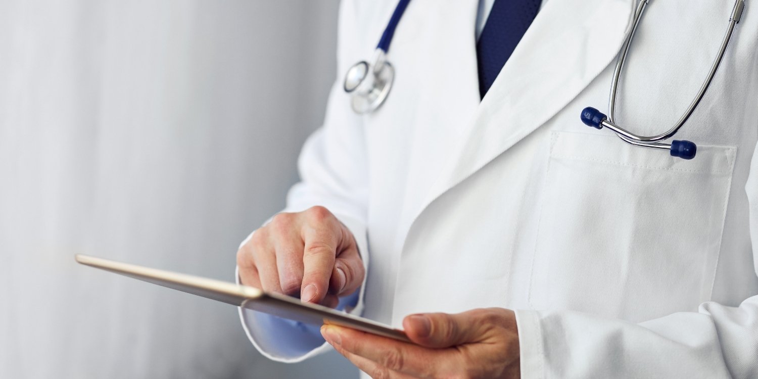 Clinician holding a tablet