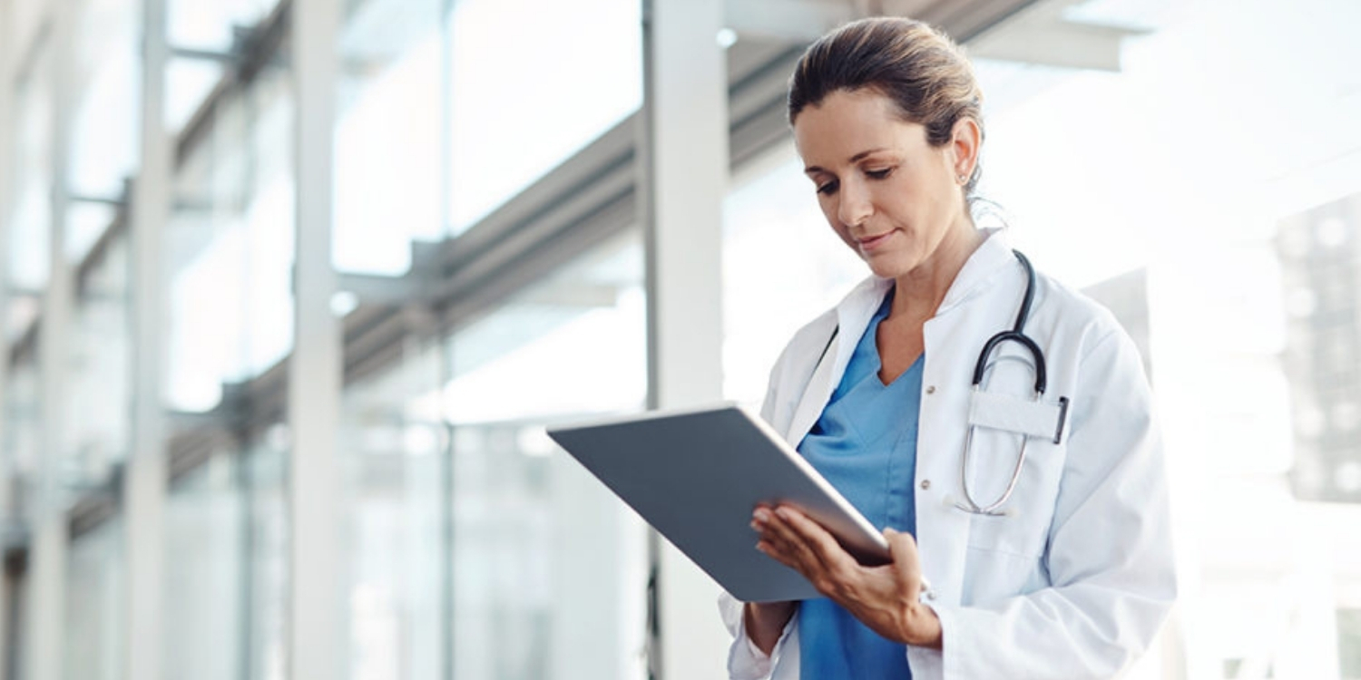 Clinician looking at a tablet