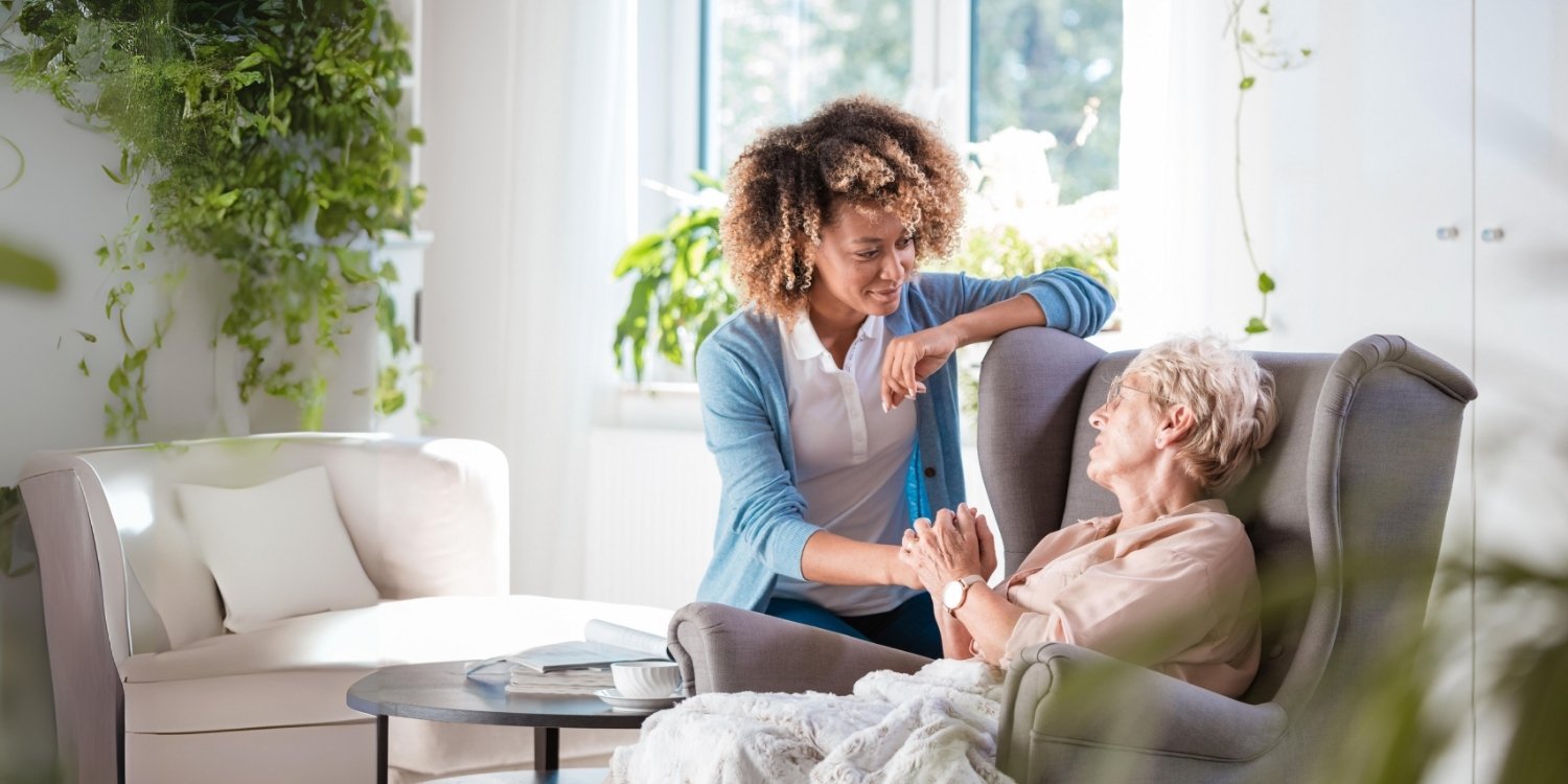 Caregiver with elderly patient.